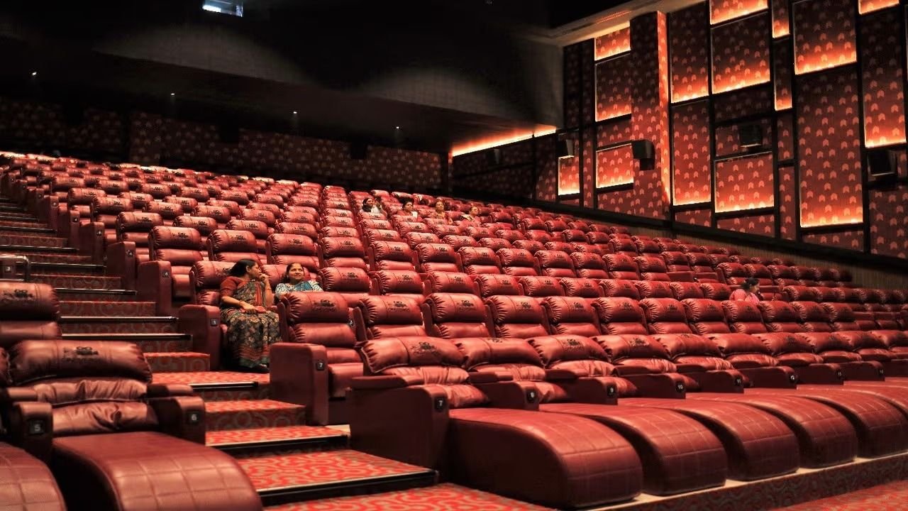 Cineverse Multiplex Bardoli auditorium with red leather recliners