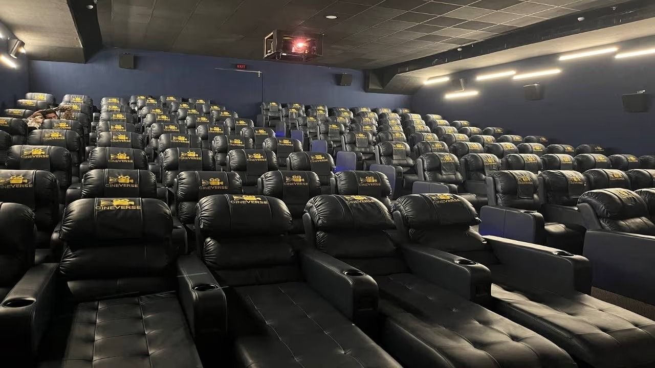 Cineverse Multiplex Katargam auditorium with black Cineverse-branded recliners