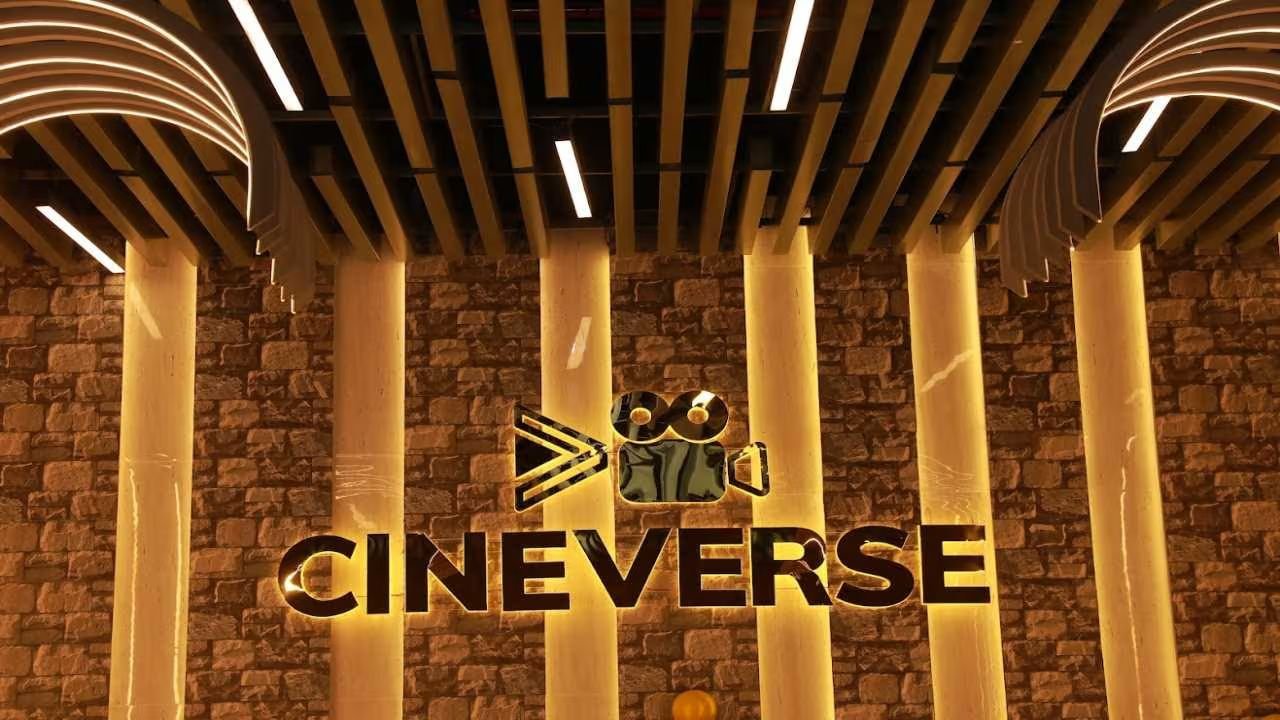 The illuminated Cineverse logo sign on a stone feature wall