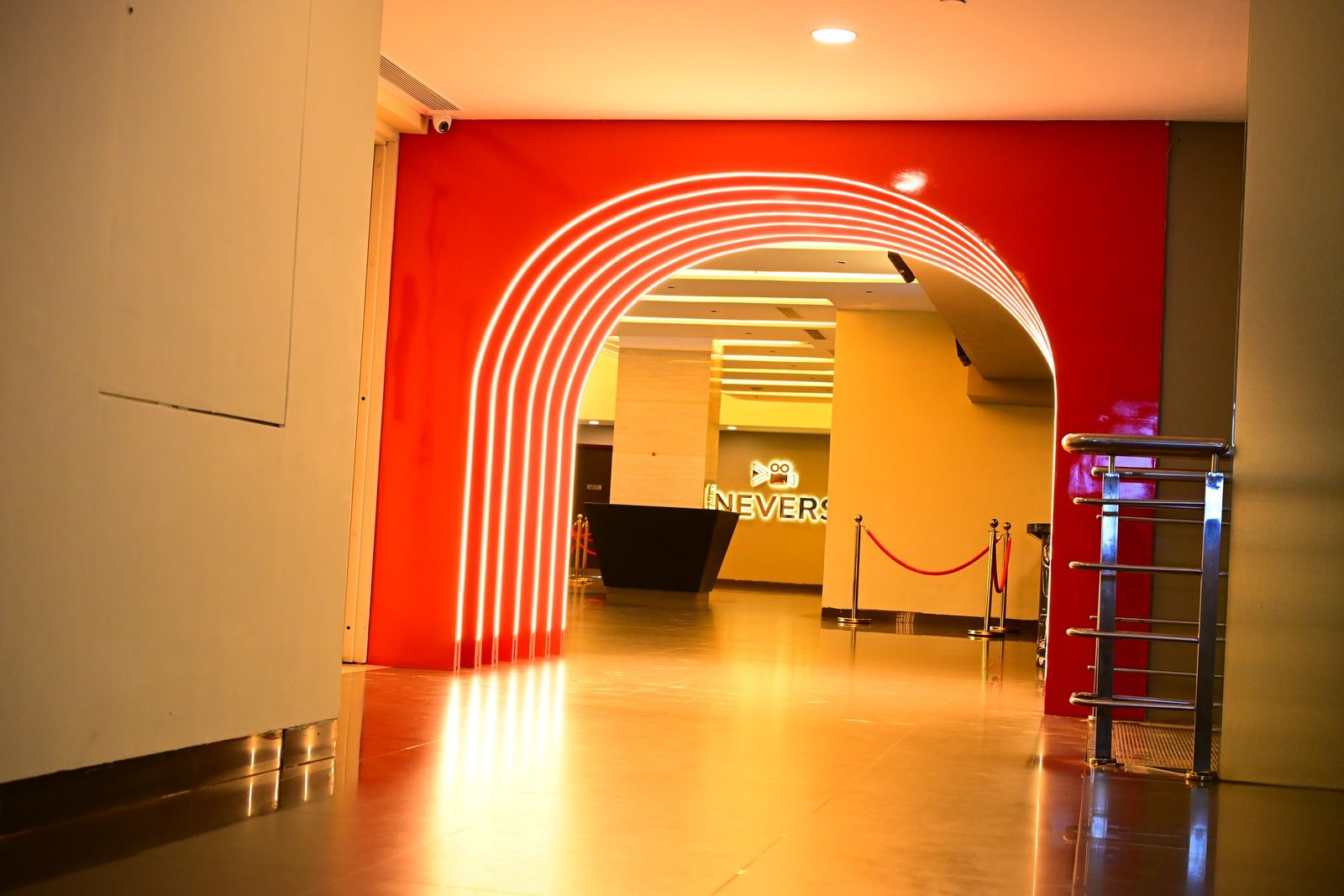 The neon archway leading into a Cineverse Multiplex lobby