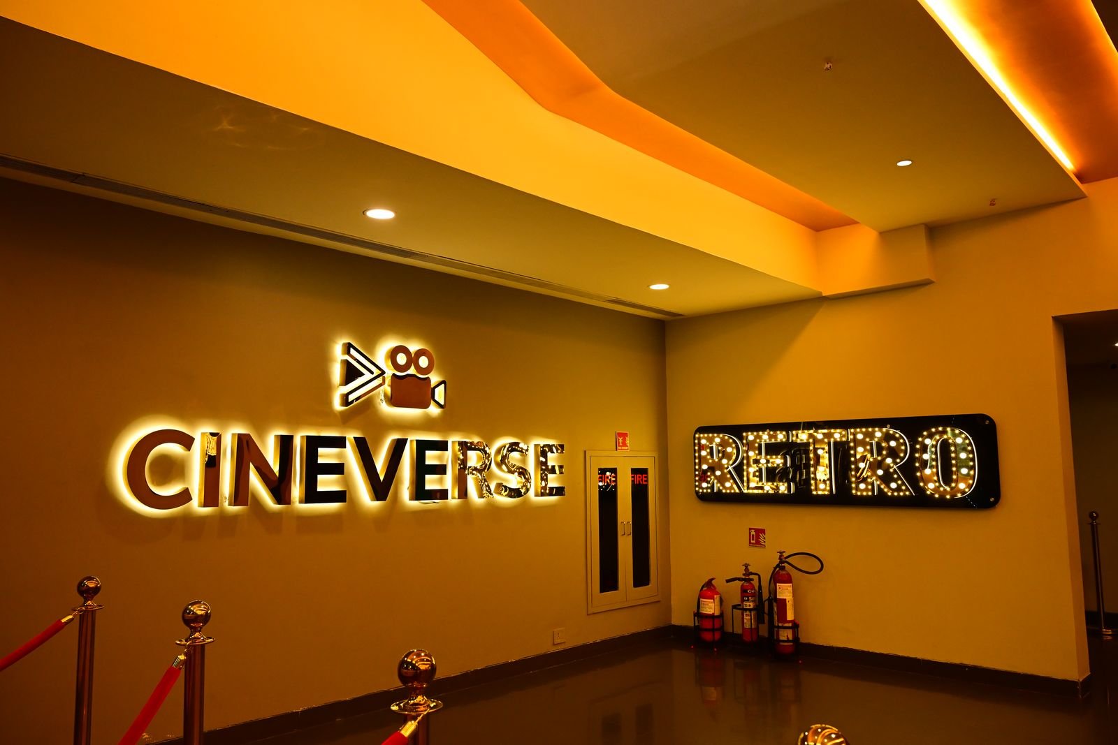 The illuminated Cineverse and Retro signage in the lobby